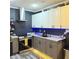 This kitchen features stainless steel appliances, stylish grey cabinets, modern lighting, and a functional layout at 210 Paris Dr, Lawrenceville, GA 30043
