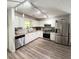 Modern kitchen featuring stainless steel appliances and bright lighting at 210 Paris Dr, Lawrenceville, GA 30043