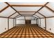 Spacious attic with a striking geometric ceiling, wooden beams, and unique floors, providing a blank canvas for customization at 4716 N Springs Ct, Atlanta, GA 30338