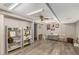 Bright finished basement with plank flooring, featuring shelves, a desk area, and ample storage, ideal for a home office at 4716 N Springs Ct, Atlanta, GA 30338