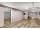 Spacious basement with plank flooring, neutral walls, and an exterior door, offering versatility and potential living space at 4716 N Springs Ct, Atlanta, GA 30338