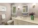 Bathroom featuring a large vanity, framed mirror, and ambient lighting at 4716 N Springs Ct, Atlanta, GA 30338
