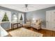 Cozy bedroom featuring two chairs, hardwood floors, area rug, and natural light at 4716 N Springs Ct, Atlanta, GA 30338