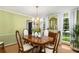 Bright dining room featuring classic decor, ample natural light, and an elegant chandelier, perfect for hosting at 4716 N Springs Ct, Atlanta, GA 30338