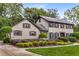 Charming two-story home with a landscaped front yard, beautiful garden, and a classic design at 4716 N Springs Ct, Atlanta, GA 30338