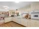 Bright kitchen featuring essential appliances, functional countertop space, and classic finishes at 4716 N Springs Ct, Atlanta, GA 30338
