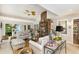 Bright living room featuring a brick fireplace and stylish decor with neutral sofas at 4716 N Springs Ct, Atlanta, GA 30338