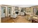 Inviting living room featuring built-in bookshelves, a cozy fireplace, and ample seating for relaxation at 4716 N Springs Ct, Atlanta, GA 30338