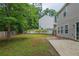 Spacious backyard featuring a concrete patio and wooden fence at 589 Arbor Ridge Dr, Stone Mountain, GA 30087