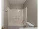 A full bathroom showcasing a shower and tub combination with modern fixtures and neutral tones at 589 Arbor Ridge Dr, Stone Mountain, GA 30087