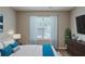 The room has a bed, window with blinds, and a dresser, ideal for a restful sanctuary at 589 Arbor Ridge Dr, Stone Mountain, GA 30087