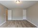 Large bedroom featuring wood-look floors and neutral colored walls at 589 Arbor Ridge Dr, Stone Mountain, GA 30087