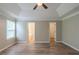 Large main bedroom features a tray ceiling and access to two separate walk-in closets at 589 Arbor Ridge Dr, Stone Mountain, GA 30087