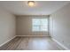 Bright and airy bedroom with large windows and modern flooring at 589 Arbor Ridge Dr, Stone Mountain, GA 30087