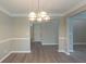Dining room with neutral paint and molding at 589 Arbor Ridge Dr, Stone Mountain, GA 30087