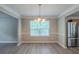 Dining area with stainless steel refrigerator and natural light at 589 Arbor Ridge Dr, Stone Mountain, GA 30087