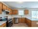 Well-appointed kitchen with stainless steel appliances, quartz countertops, and modern fixtures at 589 Arbor Ridge Dr, Stone Mountain, GA 30087
