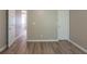 Living room with light walls, hard surface floors, and white doors and trim at 589 Arbor Ridge Dr, Stone Mountain, GA 30087