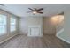 Spacious living room with fireplace, modern floors, and plenty of natural light at 589 Arbor Ridge Dr, Stone Mountain, GA 30087