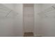 Walk-in closet with a simple, yet effective design with shelves for organizing personal items at 589 Arbor Ridge Dr, Stone Mountain, GA 30087