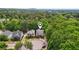 Lovely aerial view of the home surrounded by mature trees in a desirable neighborhood at 3800 Market Walk, Clarkston, GA 30021