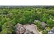 An aerial view displays a suburban neighborhood nestled among green trees at 3800 Market Walk, Clarkston, GA 30021