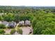 This aerial view shows homes and trees in a suburban neighborhood; perfect for nature lovers at 3800 Market Walk, Clarkston, GA 30021