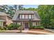 Charming two-story home features a well-manicured lawn and inviting front porch at 3800 Market Walk, Clarkston, GA 30021