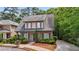 Charming two-story home features a well-manicured lawn and inviting front porch at 3800 Market Walk, Clarkston, GA 30021