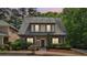 Charming two-story home features a well-manicured lawn and inviting front porch at 3800 Market Walk, Clarkston, GA 30021