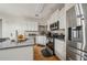 Close up of the kitchen featuring stainless steel appliances and granite countertops at 3800 Market Walk, Clarkston, GA 30021