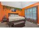 Comfortable main bedroom features bright colors, carpet, and ceiling fan at 3800 Market Walk, Clarkston, GA 30021