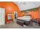 Comfortable main bedroom features bright colors, carpet, and ceiling fan at 3800 Market Walk, Clarkston, GA 30021