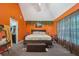 Comfortable main bedroom features bright colors, carpet, and ceiling fan at 3800 Market Walk, Clarkston, GA 30021