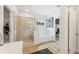 Clean bathroom features a tub, standalone shower, and closet access at 727 Hedwig Dr, Mcdonough, GA 30252
