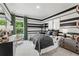 Stylish bedroom with black and white striped walls, modern furniture, and natural light at 727 Hedwig Dr, Mcdonough, GA 30252