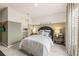Bedroom with a two-tone accent wall, stylish decor, and soft carpet at 727 Hedwig Dr, Mcdonough, GA 30252