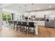 Spacious kitchen with white cabinets, island seating, and stainless steel appliances at 727 Hedwig Dr, Mcdonough, GA 30252