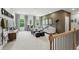 Bright living area featuring a large sectional sofa, black accents, and natural light at 727 Hedwig Dr, Mcdonough, GA 30252