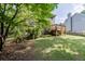 Landscaped backyard featuring a spacious deck, lawn and plenty of space at 900 Meadowsong Cir, Lawrenceville, GA 30043