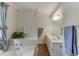 Well-lit bathroom featuring a soaking tub and double sink vanity with matching neutral paint at 900 Meadowsong Cir, Lawrenceville, GA 30043