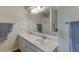 Bathroom featuring a double sink vanity, large mirror, and ample counter space at 900 Meadowsong Cir, Lawrenceville, GA 30043
