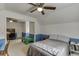 A bedroom with attached playroom, featuring blue wainscoting and a ceiling fan at 900 Meadowsong Cir, Lawrenceville, GA 30043