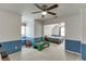 A playroom and bedroom combo with blue wainscoting and a ceiling fan at 900 Meadowsong Cir, Lawrenceville, GA 30043