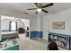 A bedroom and playroom combo featuring blue wainscoting and ample natural light at 900 Meadowsong Cir, Lawrenceville, GA 30043