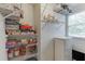 Pantry shelves loaded with board games and storage solutions at 900 Meadowsong Cir, Lawrenceville, GA 30043