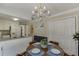 Dining area with chandelier viewed from kitchen at 900 Meadowsong Cir, Lawrenceville, GA 30043