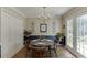 A view of a traditionally decorated dining area with french doors and a closet at 900 Meadowsong Cir, Lawrenceville, GA 30043