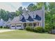 Charming home with a covered porch, complemented by an expansive, well-maintained lawn and an attached two-car garage at 900 Meadowsong Cir, Lawrenceville, GA 30043