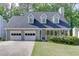 Charming two-story home with a welcoming porch, complemented by a well-maintained lawn and attached two-car garage at 900 Meadowsong Cir, Lawrenceville, GA 30043